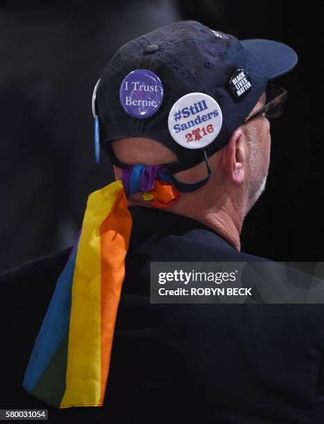 Man wears a bernie hat prior to the start of Day 1 of the Democratic National Convention at the Wells Fargo Center in Philadelphia, Pennsylvania,...