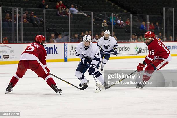 Alec Marsh of the Penn State Nittany Lions dekes around the defense during the quarterfinal game between the Penn State Nittany Lions and the...