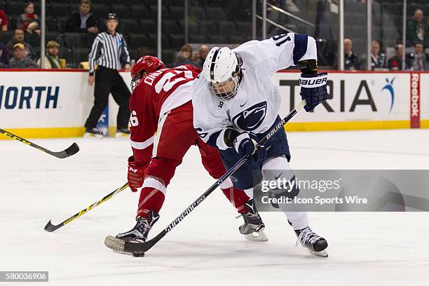 Andrew Sturtz of the Penn State Nittany Lions dekes during the quarterfinal game between the Penn State Nittany Lions and the Wisconsin Badgers...