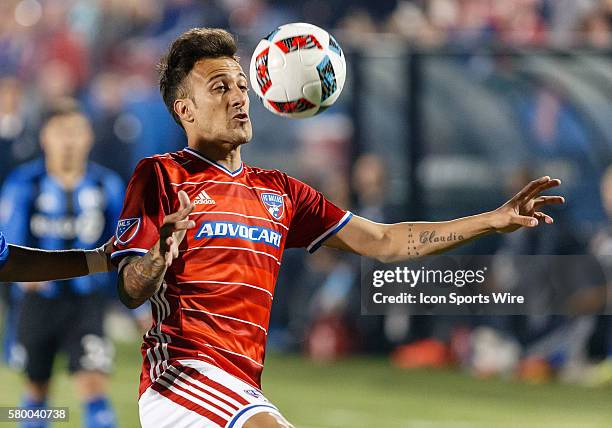 Dallas forward Maximiliano Urruti stares at a bouncing ball during the MLS match between the Montreal Impact and FC Dallas at Toyota Stadium in...