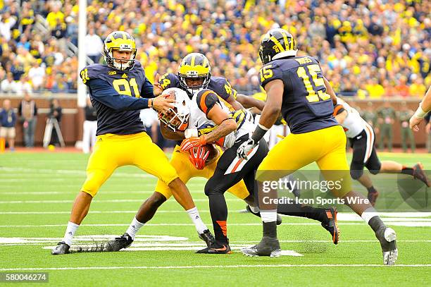 Michigan Wolverines tight end Michael Jocz and Michigan Wolverines safety Delano Hill make this tackle on the punt during the game on Saturday...