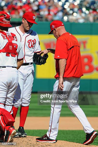 Washington Nationals relief pitcher Casey Janssen hands the ball to manager Matt Williams at Nationals Park in Washington, D.C. Where the New York...