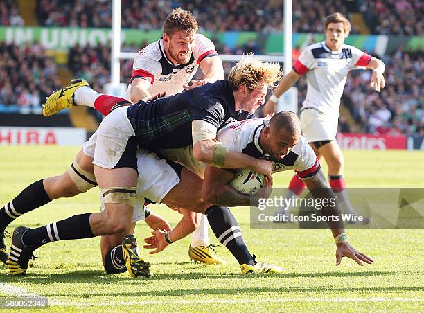 United States of America's Samu Manoa is tackled by Scotland's Richie Gray during the 2015 Rugby World cup match-up between Scotland and the USA...