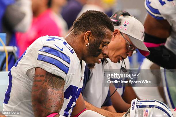 Dallas Cowboys defensive end Greg Hardy goes over defensive strategy with defensive coordinator Rod Marinelli during the game between the Dallas...