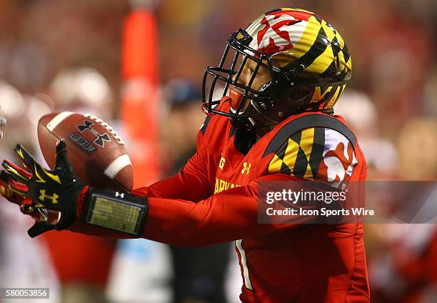 Maryland Terrapins wide receiver D.J. Moore pulls in a pass on his way to scoring a touchdown during a Big 10 football game against Wisconsin at...