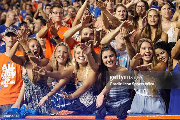 Florida Gators fans do the Gator Chomp in the 1st half of the NCAA football game between the East Carolina Pirates and the Florida Gators at Ben Hill...