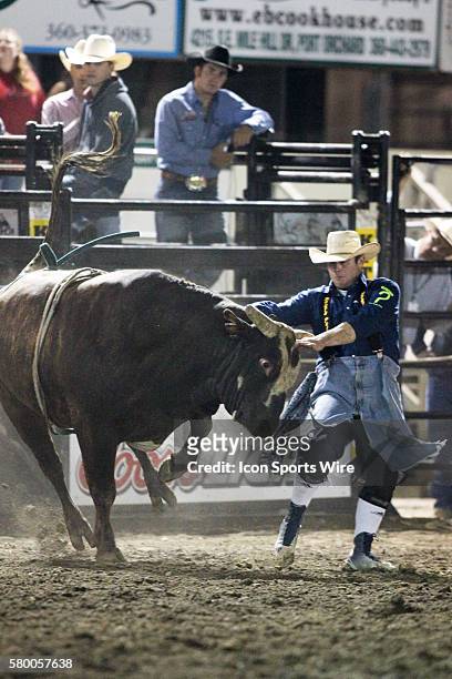 Pro bull Snuggly runs wild through the arena during the Extreme Bulls competition at the Kitsap County Stampede in Bremerton, Washington.