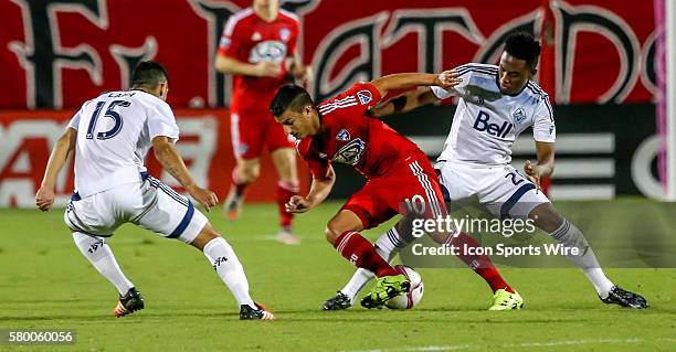 Dallas Mauro Diaz tries to get past Whitecaps Deybi Flores and Matias Laba during the MLS game between the Vancouver Whitecaps FC and FC Dallas at...