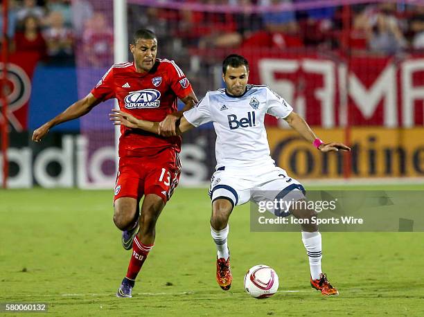 Vancouver Whitecaps Steven Beitashour tries to control the ball from FC Dallas Tesho Akindele during the MLS game between the Vancouver Whitecaps FC...