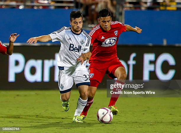 Dallas Victor Ulloa and Whitecaps Marco Bustos fight for the ball during the MLS game between the Vancouver Whitecaps FC and FC Dallas at Toyota...