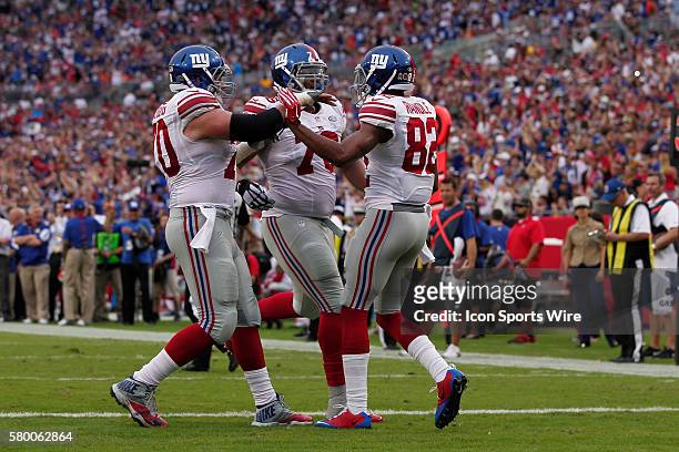 New York Giants wide receiver Rueben Randle celebrates after scoring a touchdown with New York Giants center Weston Richburg and New York Giants...
