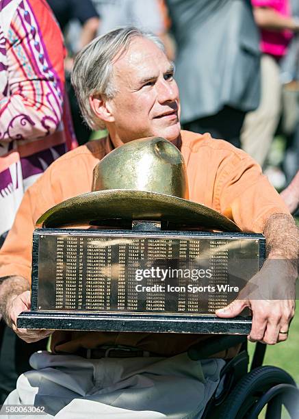 Texas Longhorns players are presented the trophy by Governor Abbot after winning the Red River Showdown after the Texas Longhorns victory over the...