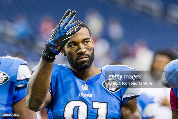 Detroit Lions wide receiver Calvin Johnson waves to fans as he walks off of the field at the end of the game between the Arizona Cardinals and the...