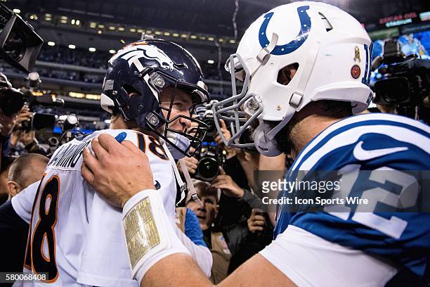 Denver Broncos Quarterback Peyton Manning [2982] shakes hands and congratulates Indianapolis Colts Quarterback Andrew Luck [14978] in action during a...