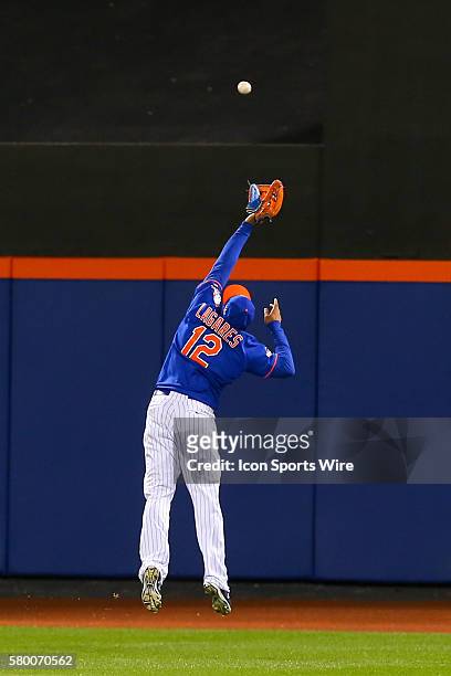 New York Mets center fielder Juan Lagares has the ball go over his head during Game 1 of the National League Championship Series between the New York...