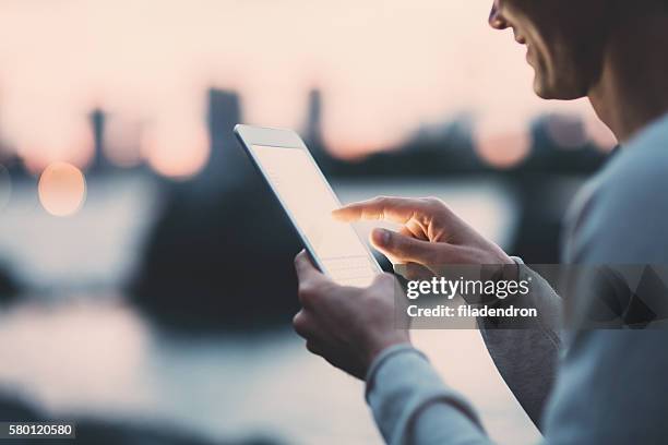 young japanese man texting on the tablet - male teen tablet bildbanksfoton och bilder
