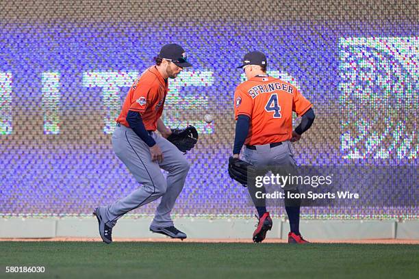 Houston Astros outfielders scramble for a loose ball during the MLB Playoff ALDS game 2 between the Houston Astros and the Kansas City Royals at...