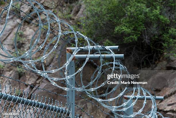 security barbed wire - razor wire stock pictures, royalty-free photos & images