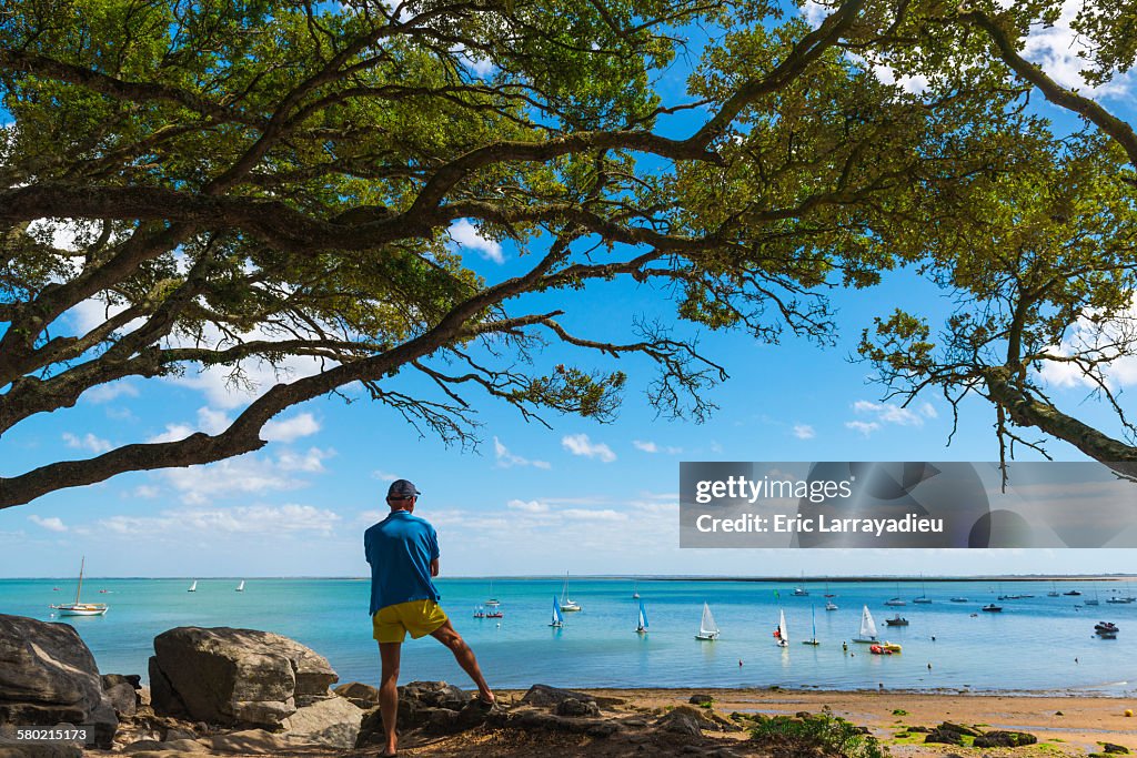 Man regarding the sea , plage des Sableaux
