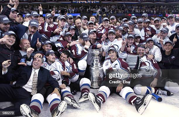 The Colorado Avalanche pose with the Stanley Cup after they defeated the New Jersey Devils 3-1 in game seven of the NHL Stanley Cup Finals at Pepsi...