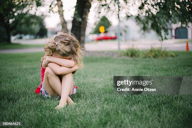 sad girl - sad children only stock pictures, royalty-free photos & images