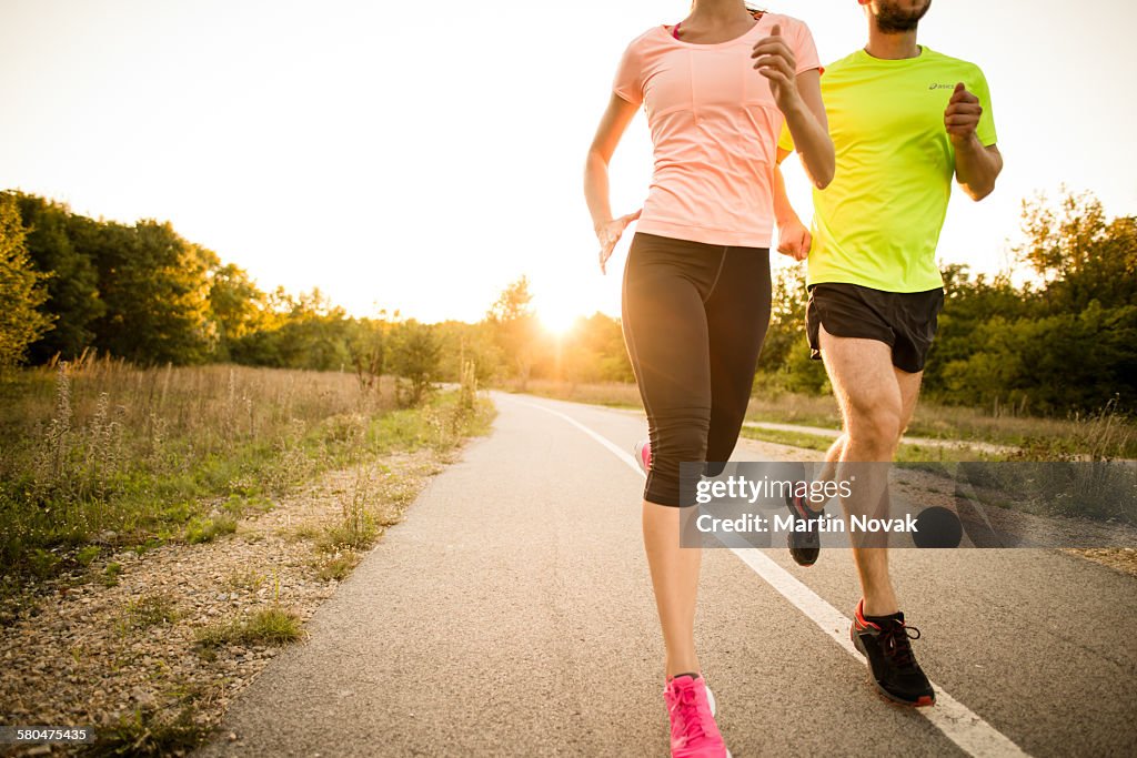 Friends jogging at sunset