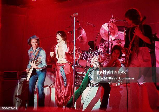 British singer Rod Stewart performing at the Olympia, London, December 1976. Left to right: Jim Cregan, Stewart, Carmine Appice , Philip Chen and...