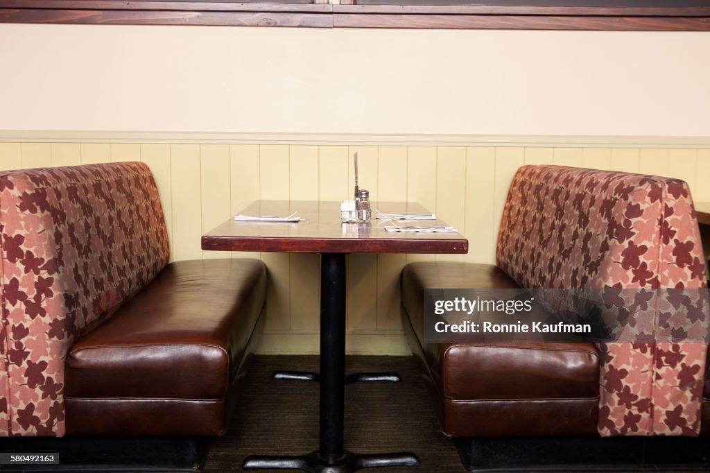Empty booth and table in restaurant