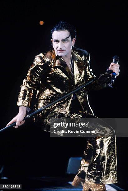 Singer Bono, in his stage persona of Mr. MacPhisto, during a concert by Irish rock group U2 on their 'Zoo TV' tour, 1992.