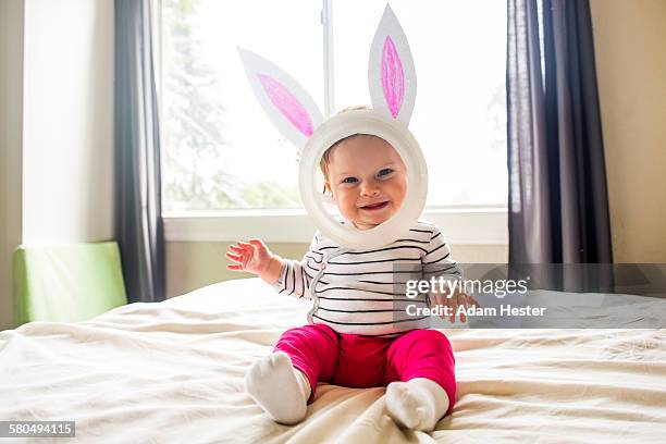 caucasian baby girl wearing easter bunny costume - easter bunny mask stockfoto's en -beelden