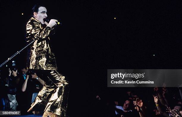 Singer Bono, in his stage persona of Mr. MacPhisto, during a concert by Irish rock group U2 on their 'Zoo TV' tour, 1992.