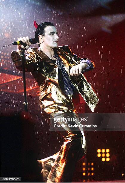 Singer Bono, in his stage persona of Mr. MacPhisto, during a concert by Irish rock group U2 on their 'Zoo TV' tour, 1992.