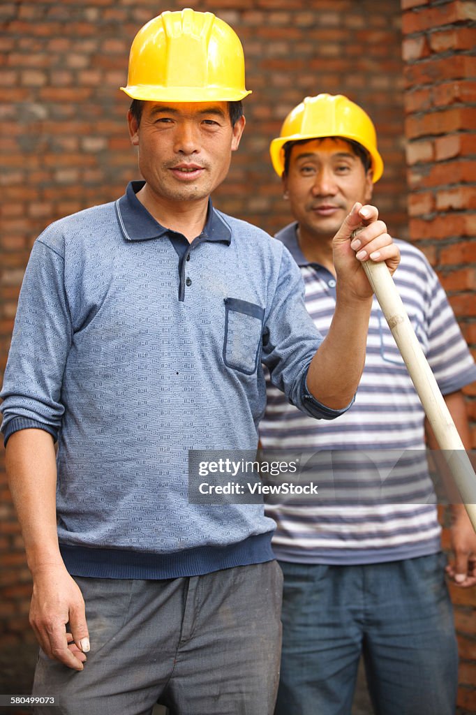 Bricklayers at construction site