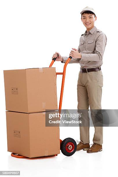 young man with push cart - delivery person on white stock pictures, royalty-free photos & images