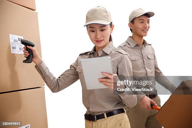 young woman and young man in warehouse - push cart stock pictures, royalty-free photos & images