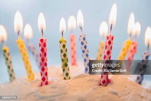 close up of birthday candles in cake - birthday candle fotografías e imágenes de stock