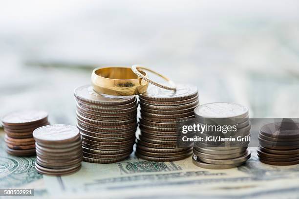 close up of stacks of coins and wedding rings - general retail in and around crawford market ahead of union budget stockfoto's en -beelden