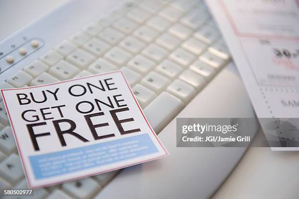 sales sticker on computer keyboard - coupons stock pictures, royalty-free photos & images