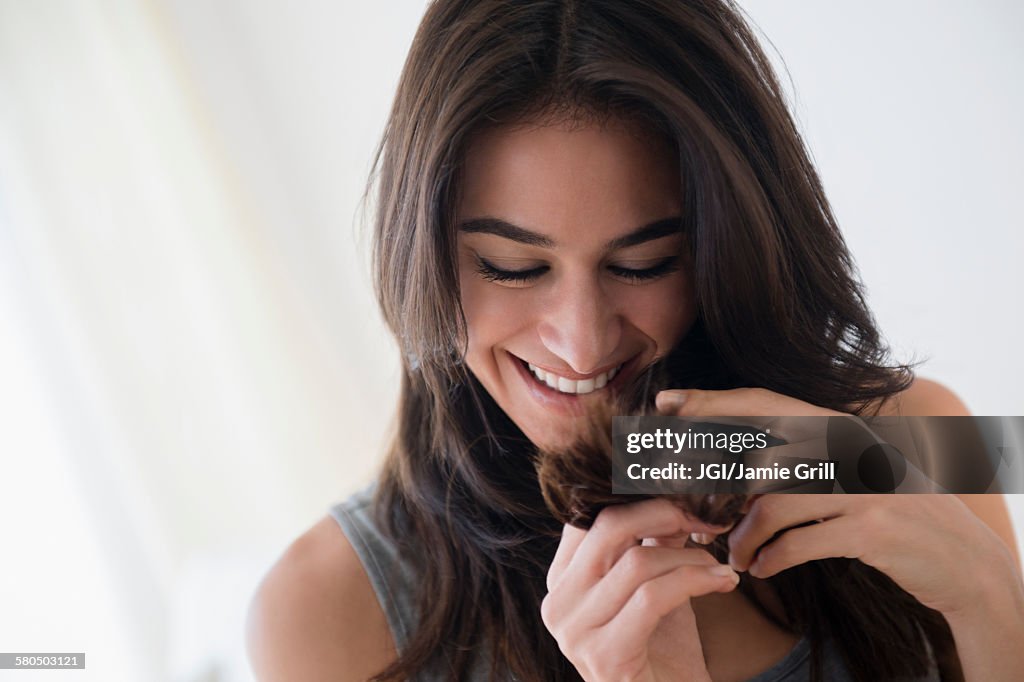 Close up of woman admiring her hair