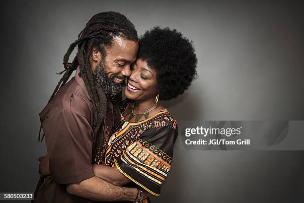 close up of smiling couple hugging - african tradition stock pictures, royalty-free photos & images