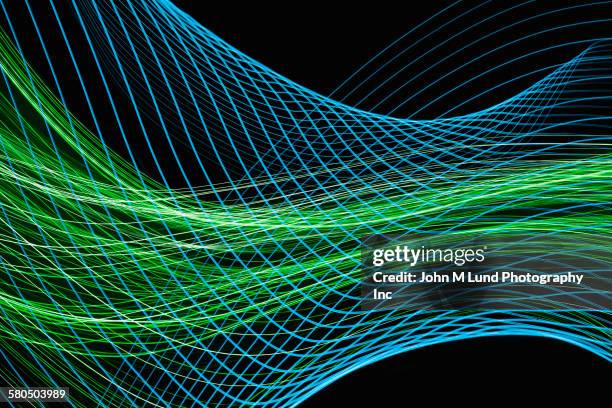 flowing blue and green lines - long exposure stock-grafiken, -clipart, -cartoons und -symbole
