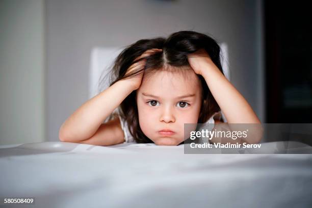 frustrated caucasian girl laying on bed - angry kid stock pictures, royalty-free photos & images