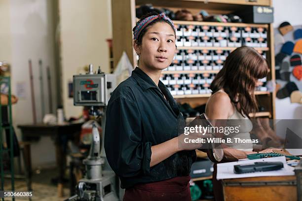 portrait of shoemaker apprentice - shoe repair stockfoto's en -beelden