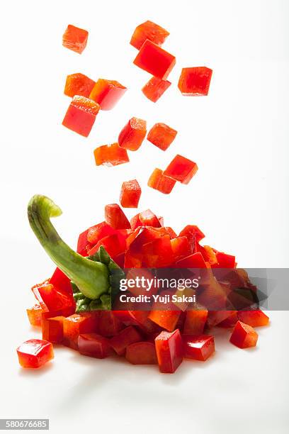 dice formed red bell pepper forming - pimiento dulce fotografías e imágenes de stock
