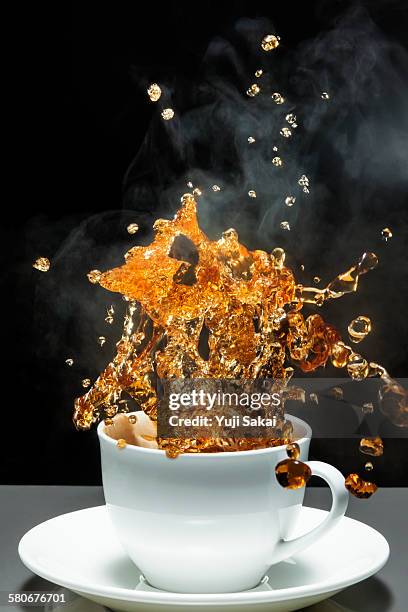 gushes out coffee - coffee splash stock-fotos und bilder