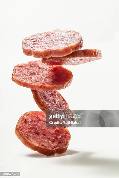 pile up sliced salami sausage - salami stock pictures, royalty-free photos & images