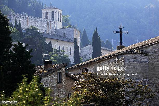 view of gubbio with tower of the cathedral in back - グッビオ ストックフォトと画像