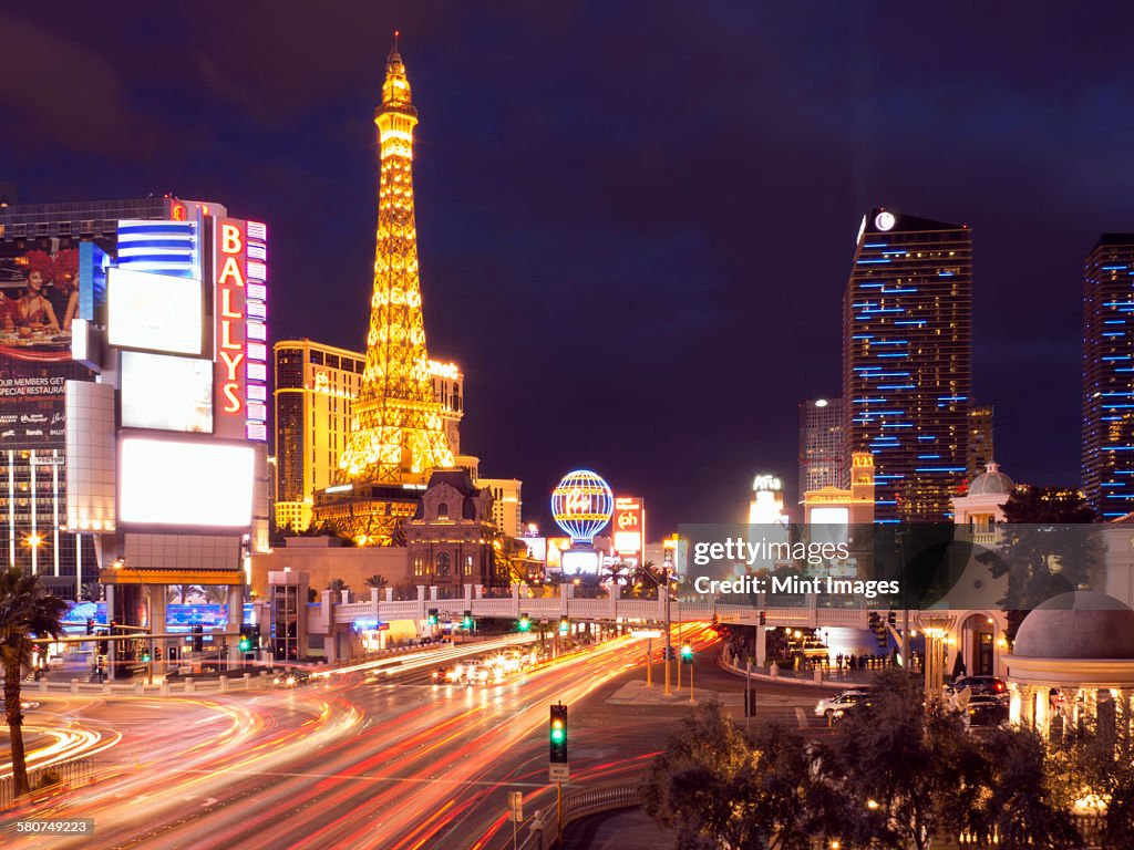 View Along The Strip In Las Vegas At Night With The Illuminated Paris Las  Vegas Hotel And Casino In The Background High-Res Stock Photo - Getty Images