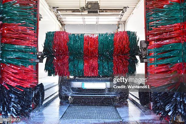 car in a car wash - car wash brush fotografías e imágenes de stock