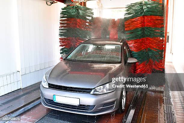 car in a car wash - car wash brush fotografías e imágenes de stock